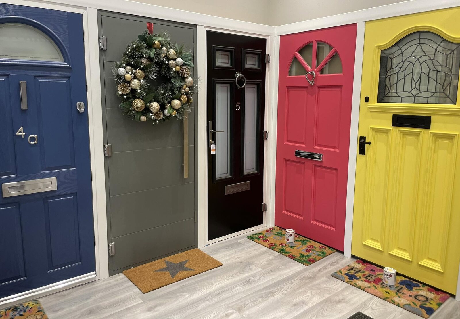A blue composite front door on the showroom wall